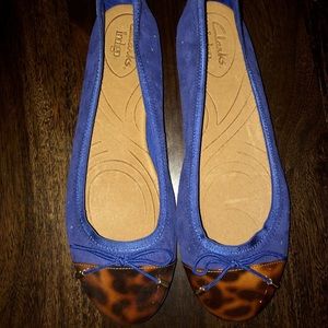 Clark’s blue suede and tortoise flats.